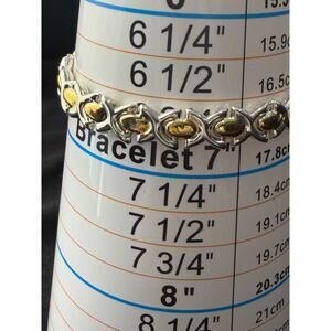 Sterling Silver “925 Italy” X and O link reversible bracelet with 14k plating.